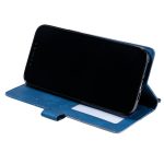 Blue wallet-style phone case propping a black smartphone in landscape orientation as a stand