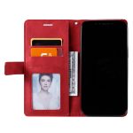 Open red wallet phone case showing card slots with two cards, a clear ID photo, cash, and a smartphone on the right side.