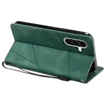 Green leather-style folio phone case with a tri-camera cutout, shown propped up with a wrist strap attached.