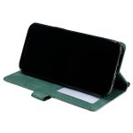 Green folio phone case propping a black smartphone in landscape mode, with a white card peeking from a slot beneath.