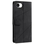 Back view of a black leather wallet-style phone case with a diagonal panel design and a magnetic strap.
