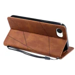 Brown leather phone case folded into a stand with diagonal stitched lines and a wrist strap showing on the side boundary.