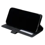 Elegantna_flip_line_torbica-Honor_600_Lite-crna-8 | Poceni-Ovitki.si Black smartphone in a black folio-style case propped up on a stand for hands-free viewing