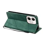 Green leather phone case with a built-in stand and geometric stitched pattern, positioned to show the camera cutout.